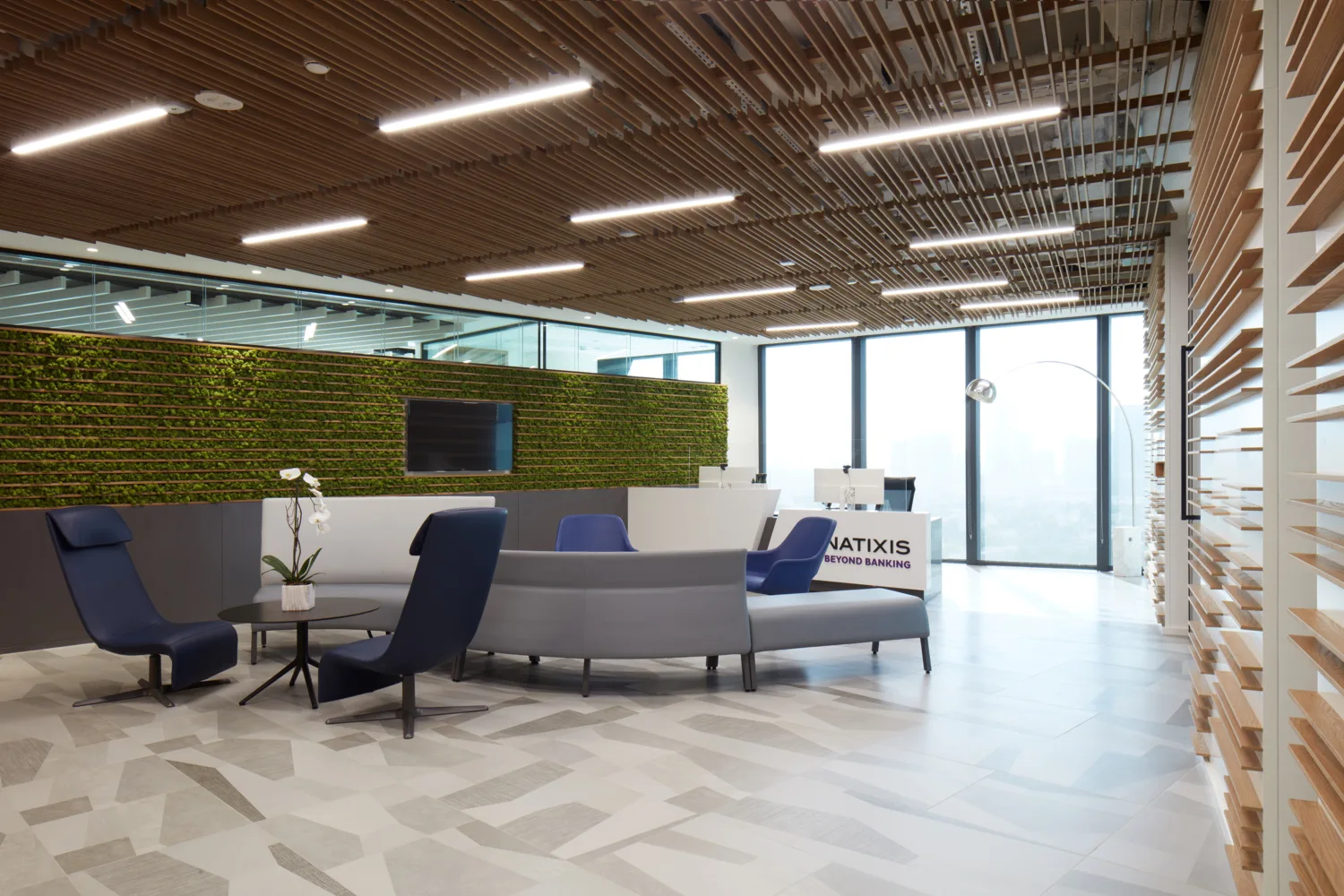 Natixis Dubai office reception and waiting area with TV and Chairs