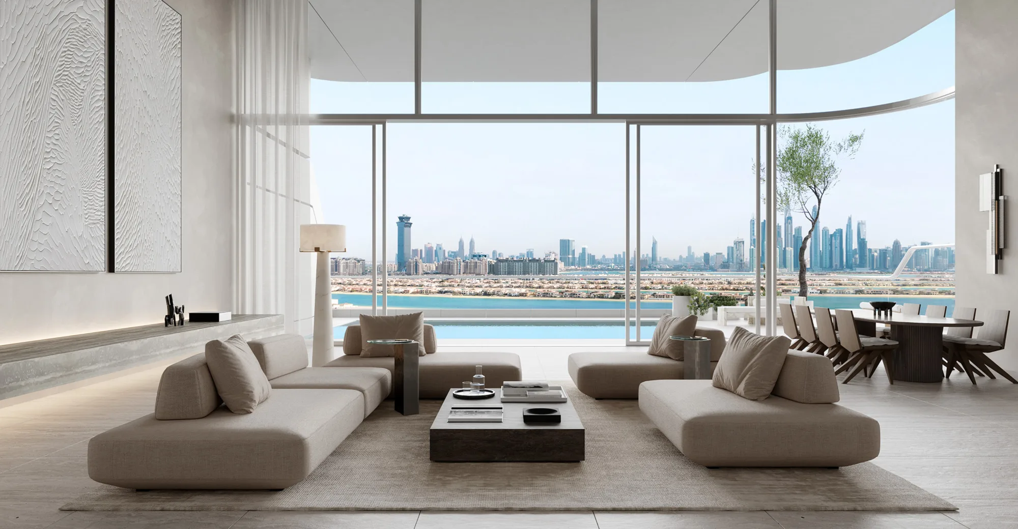 Spacious modern living room with neutral-toned sofas around a low coffee table, floor-to-ceiling windows overlooking a waterfront skyline. A balcony pool, dining area, textured wall panels, and minimalist décor are visible in bright natural light.