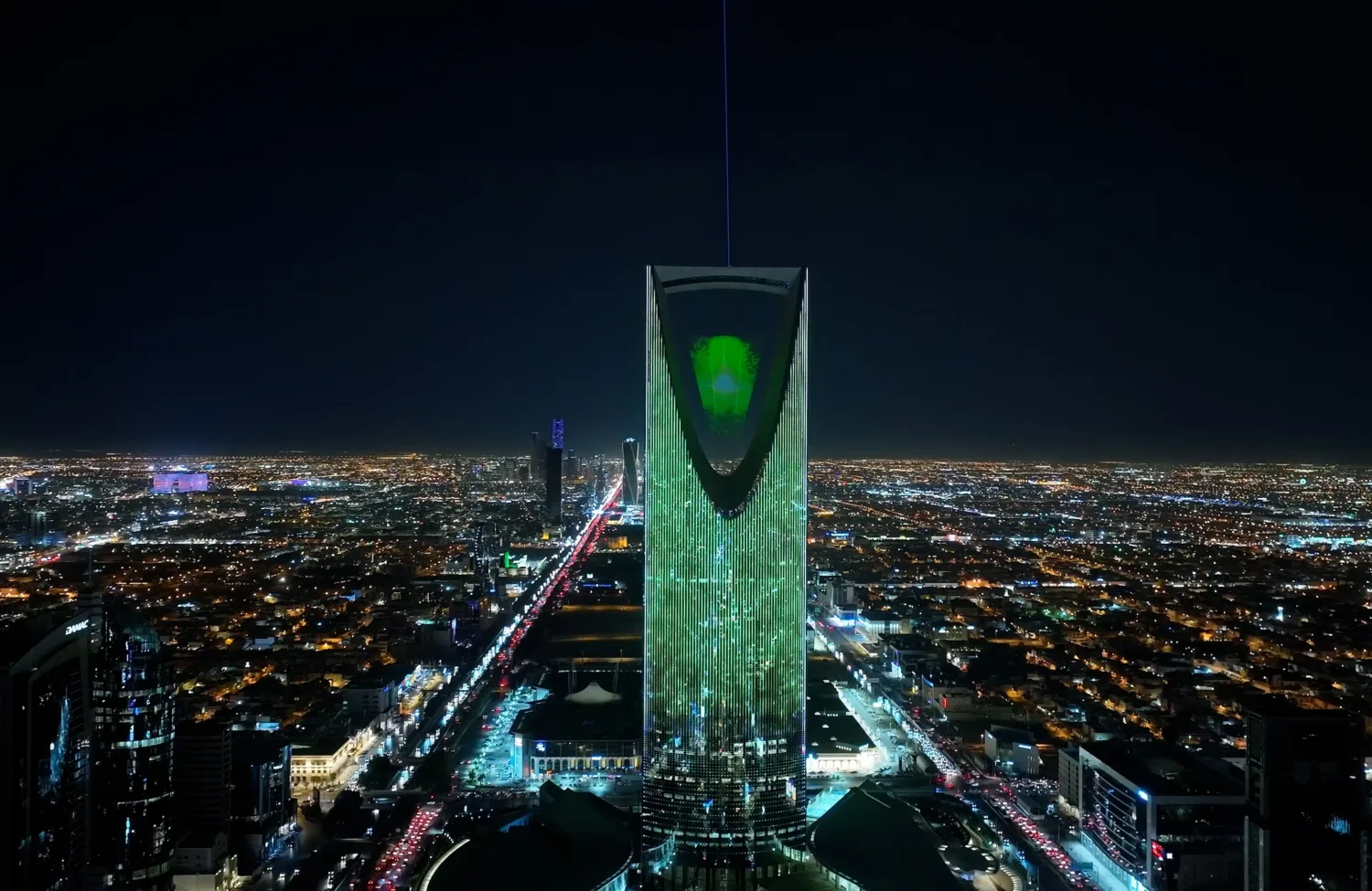 The art installation suspended in Kingdom Centre Tower illuminated in the night sky of Riyadh