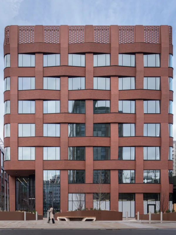 Brick and glass building facade of Three New Bailey