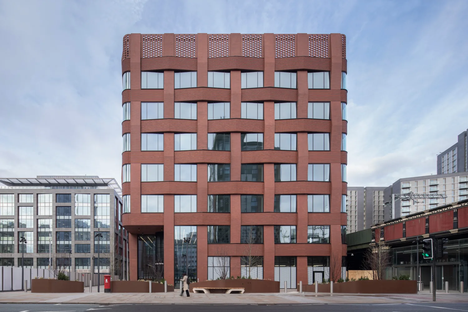 Brick and glass building facade of Three New Bailey