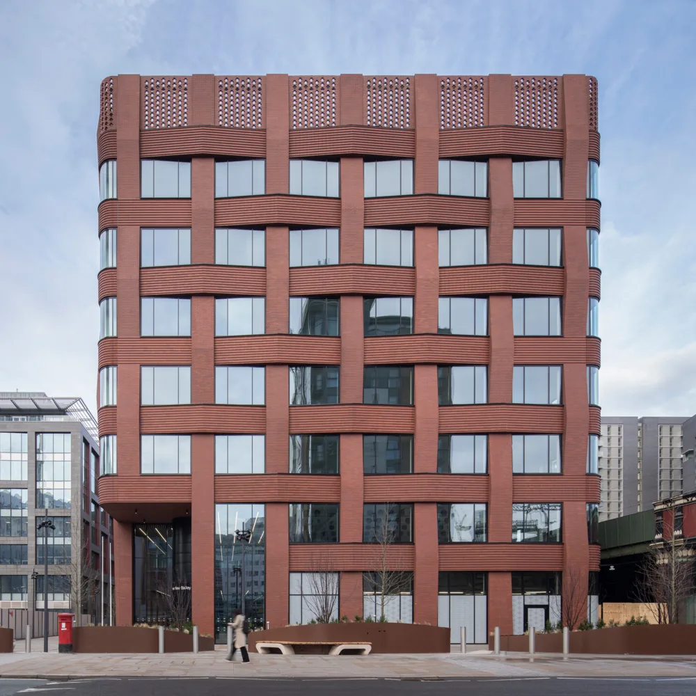 Brick and glass building facade of Three New Bailey