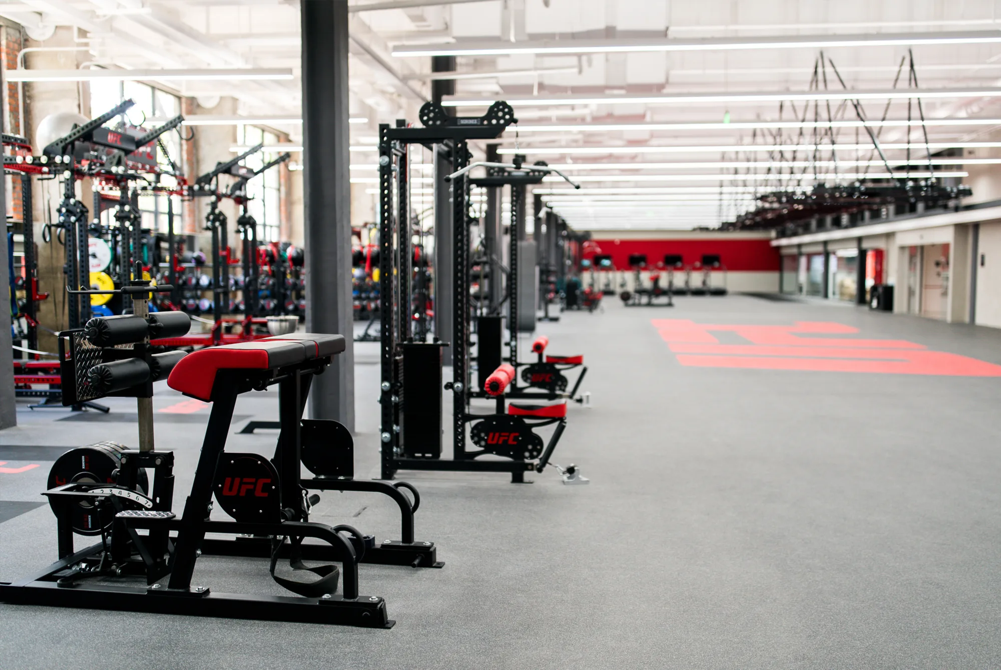 Large, spacious gym featuring various exercise equipment