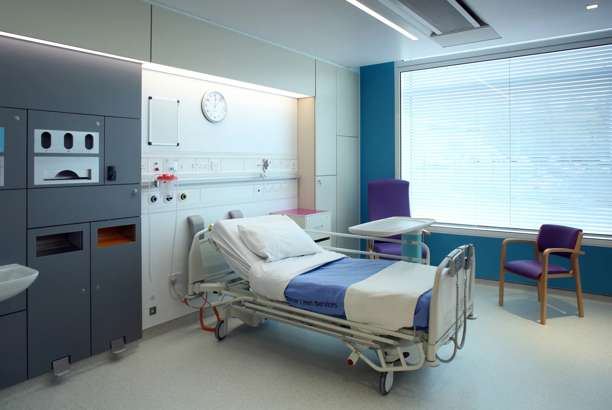 Hospital room interior with bed and medical equipment