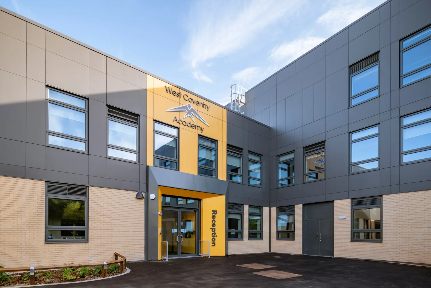 Front entrance of the West Coventry Academy with signage above the door