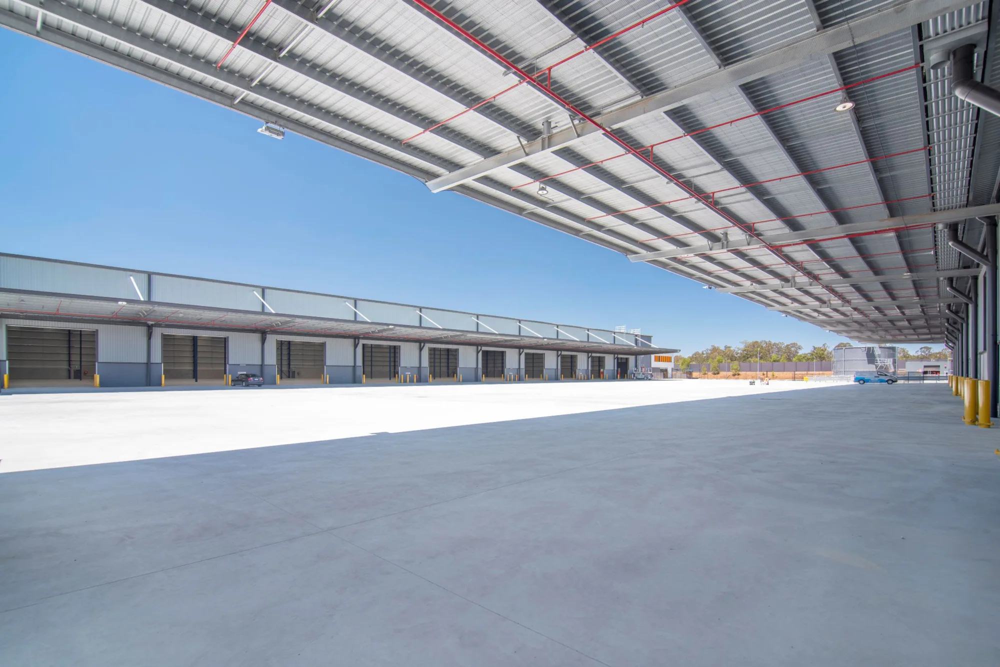Distribution centre warehouse building with sky in background 