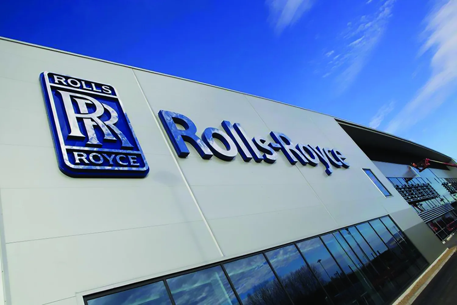 Exterior of Rolls-Royce factory against a blue sky