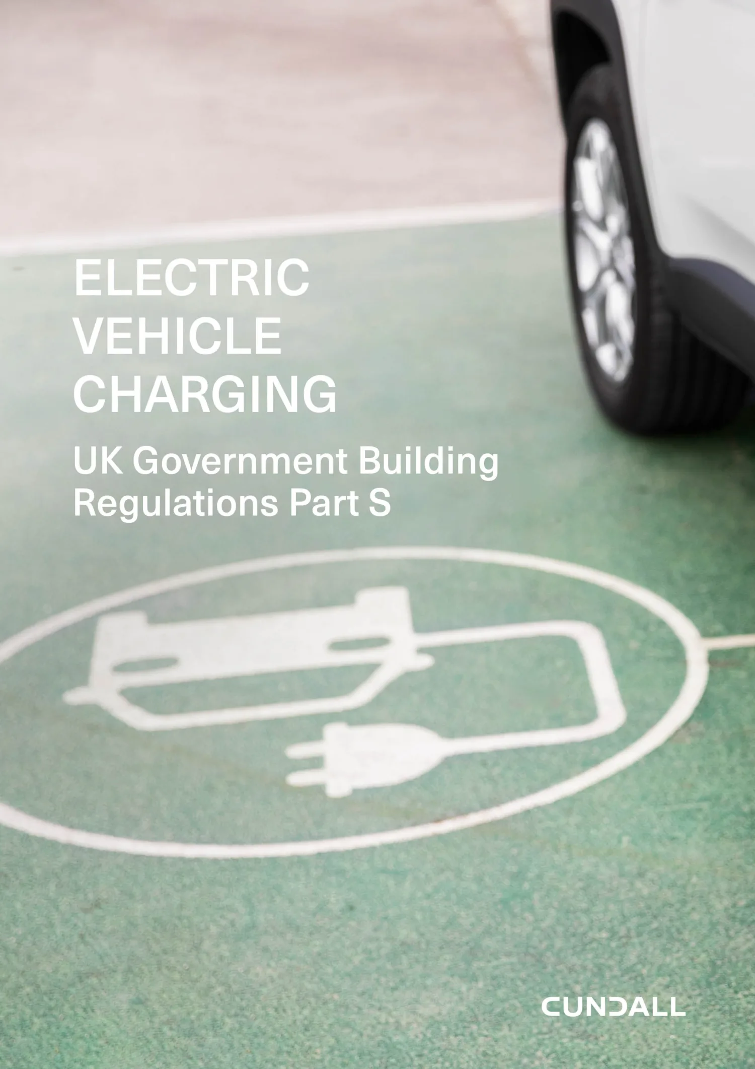 Front cover image of document showing rear wheel of white car on green tarmac with an electric charging icon on it