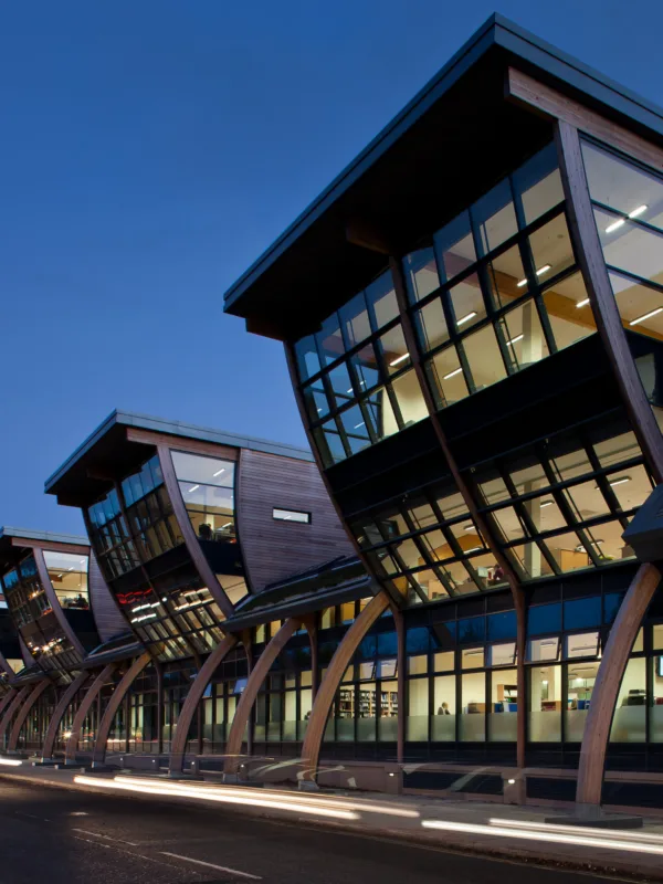Evening shot of the exterior façade of glass and wood of the Palatine Centre, Durham University