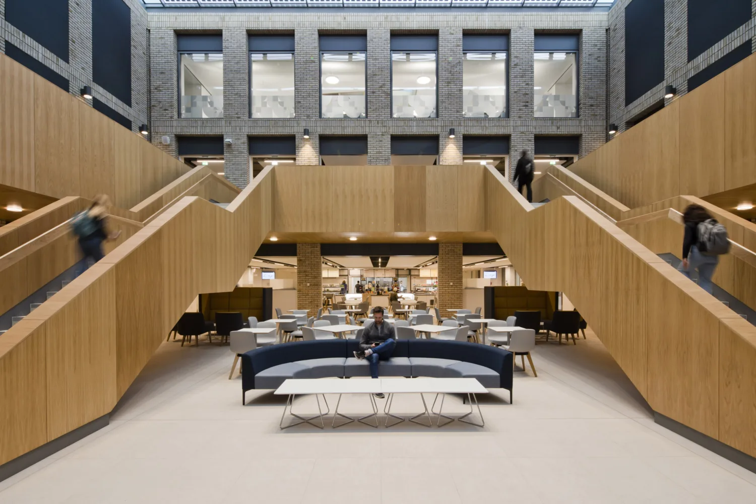 Lower Mountjoy Teaching and Learning Centre foyer area with seating and wooden staircases