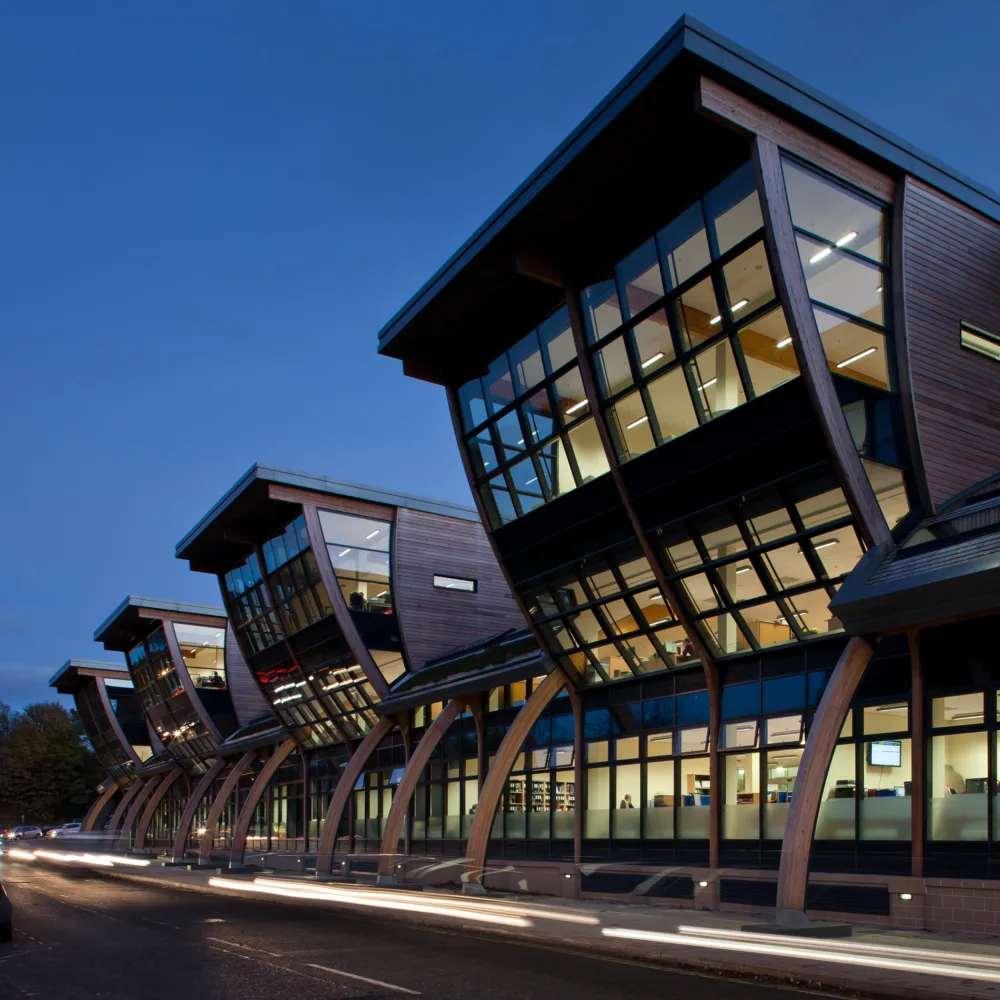 Evening shot of the exterior façade of glass and wood of the Palatine Centre, Durham University