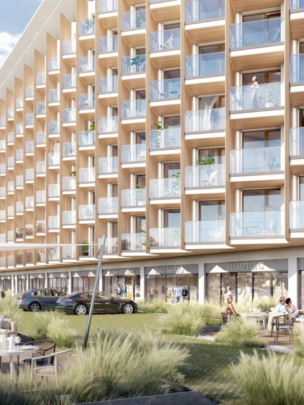 Exterior façade of the PINEA Resort and Apartments, with stream and exterior decking