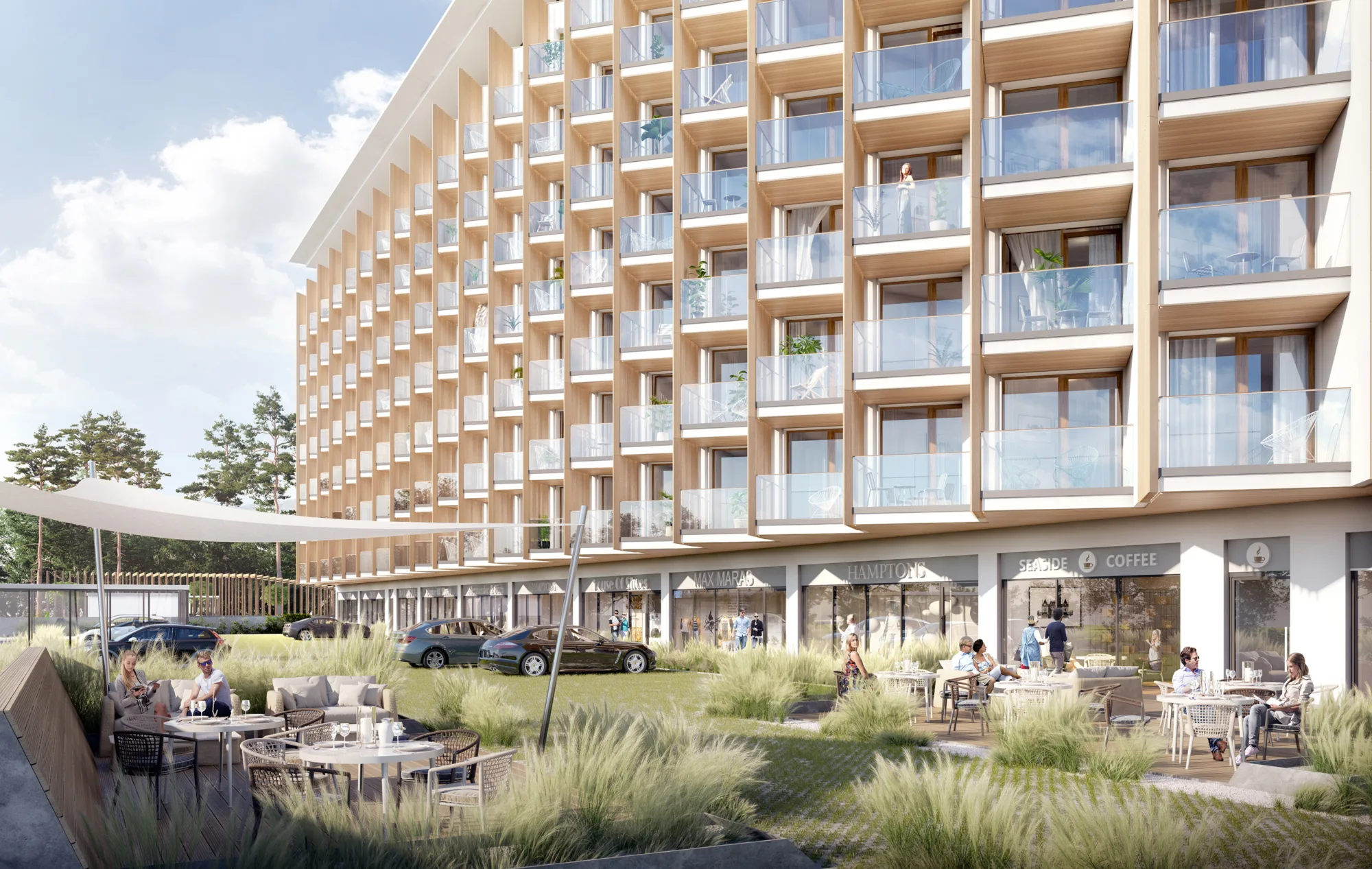 Exterior façade of the PINEA Resort and Apartments, with stream and exterior decking