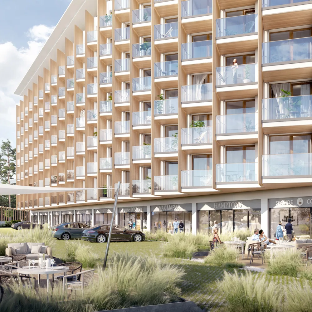 Exterior façade of the PINEA Resort and Apartments, with stream and exterior decking