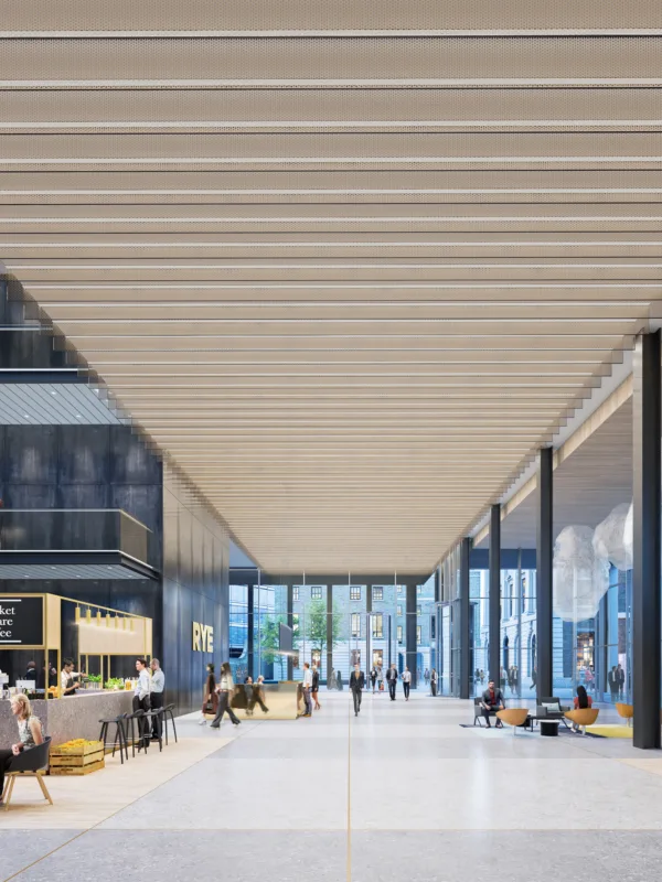 Foyer interior with cafe and meetings spaces full of people at the Royal Mint Court, London