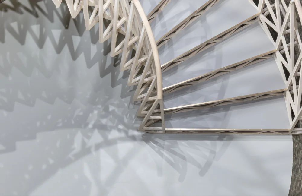 Overhead view of a white curved stairway