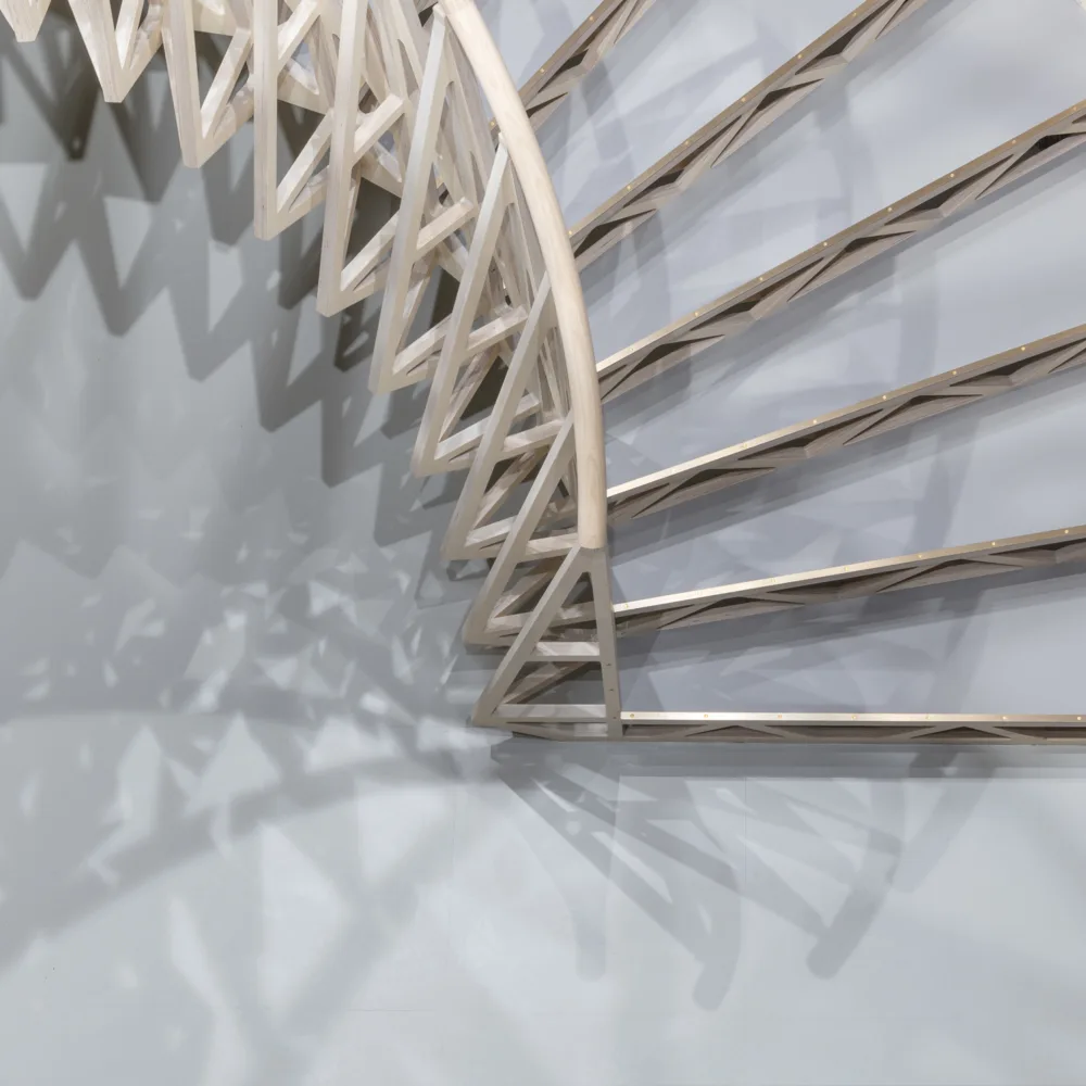 Overhead view of a white curved stairway