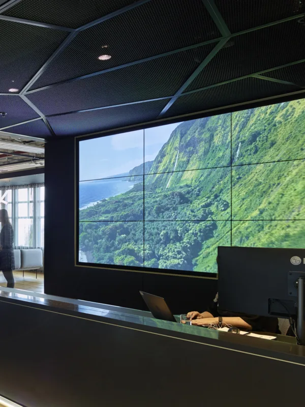 A+E Network office reception area with computer screen and reception tables with staff