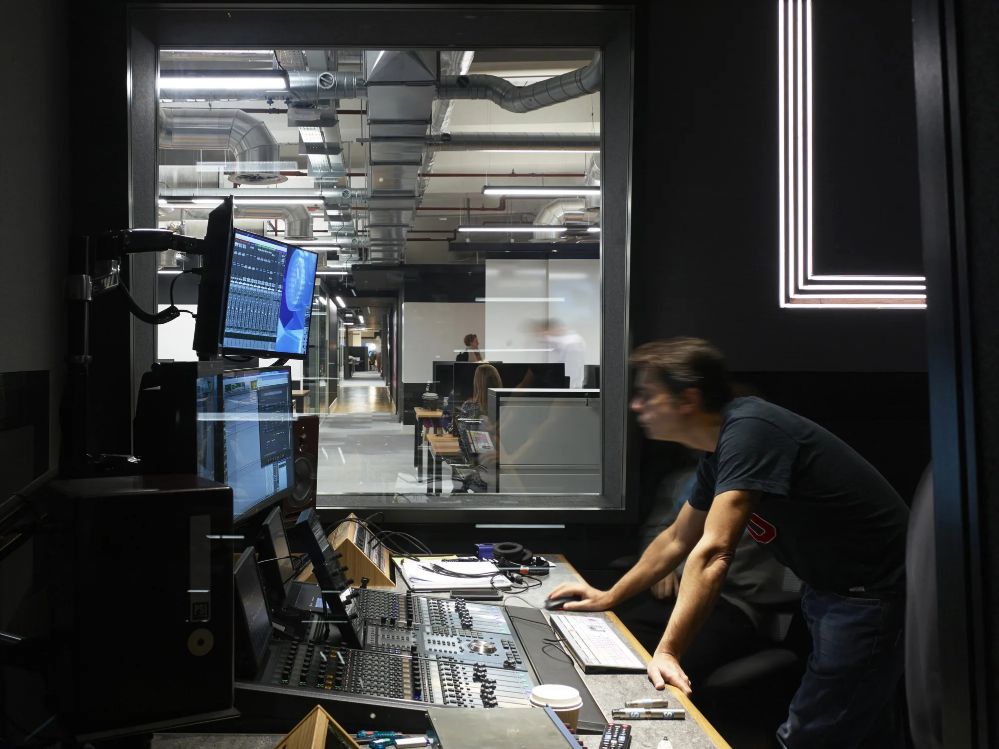 Server room with computers and staff working