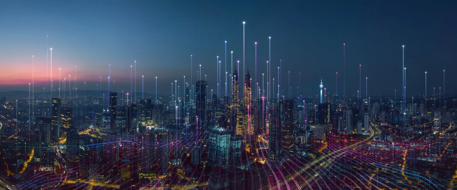 City with light beams highlighting parts of the city