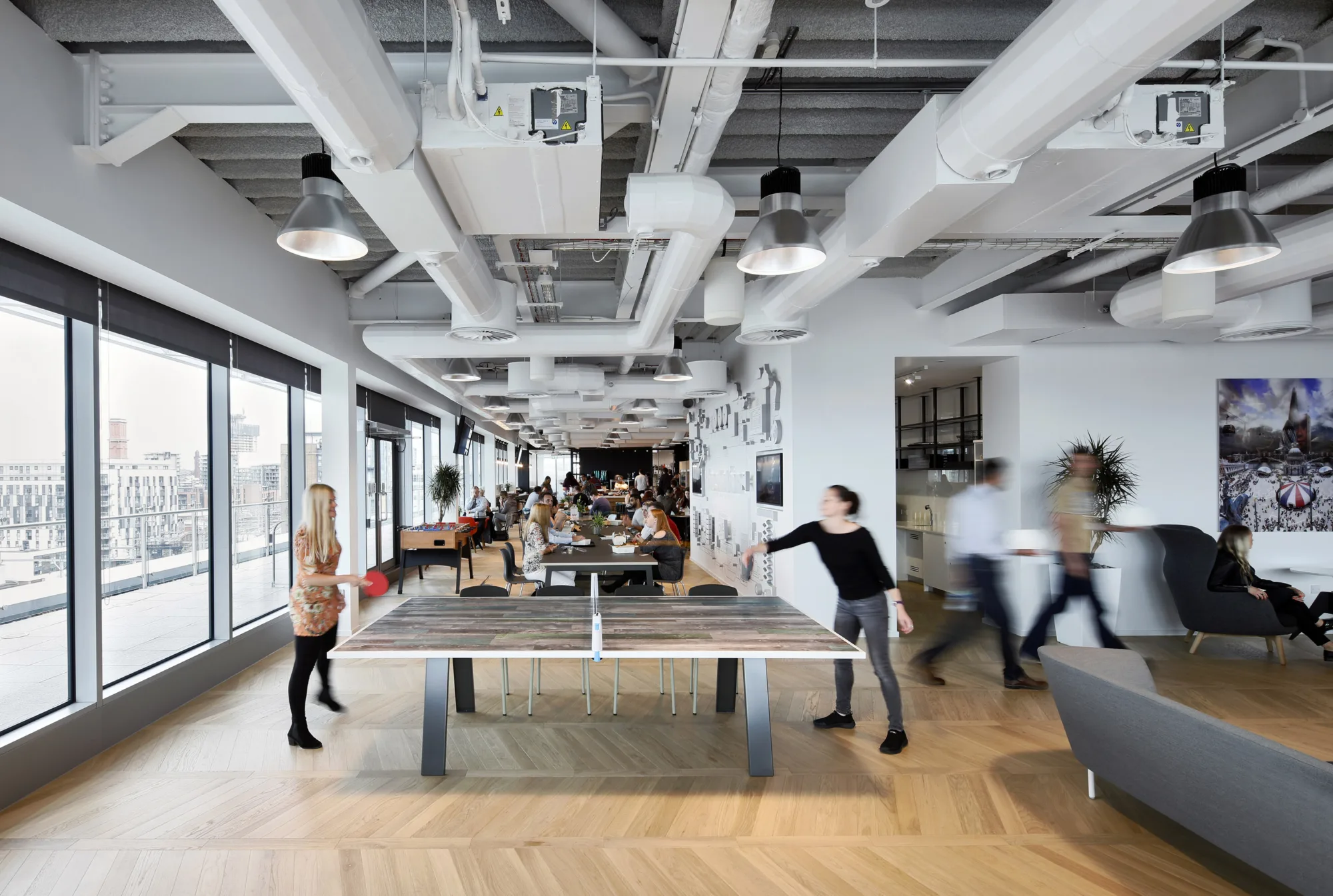 Freshfields Bruckhaus Deringer office interior with ping pong tables and seating for staff