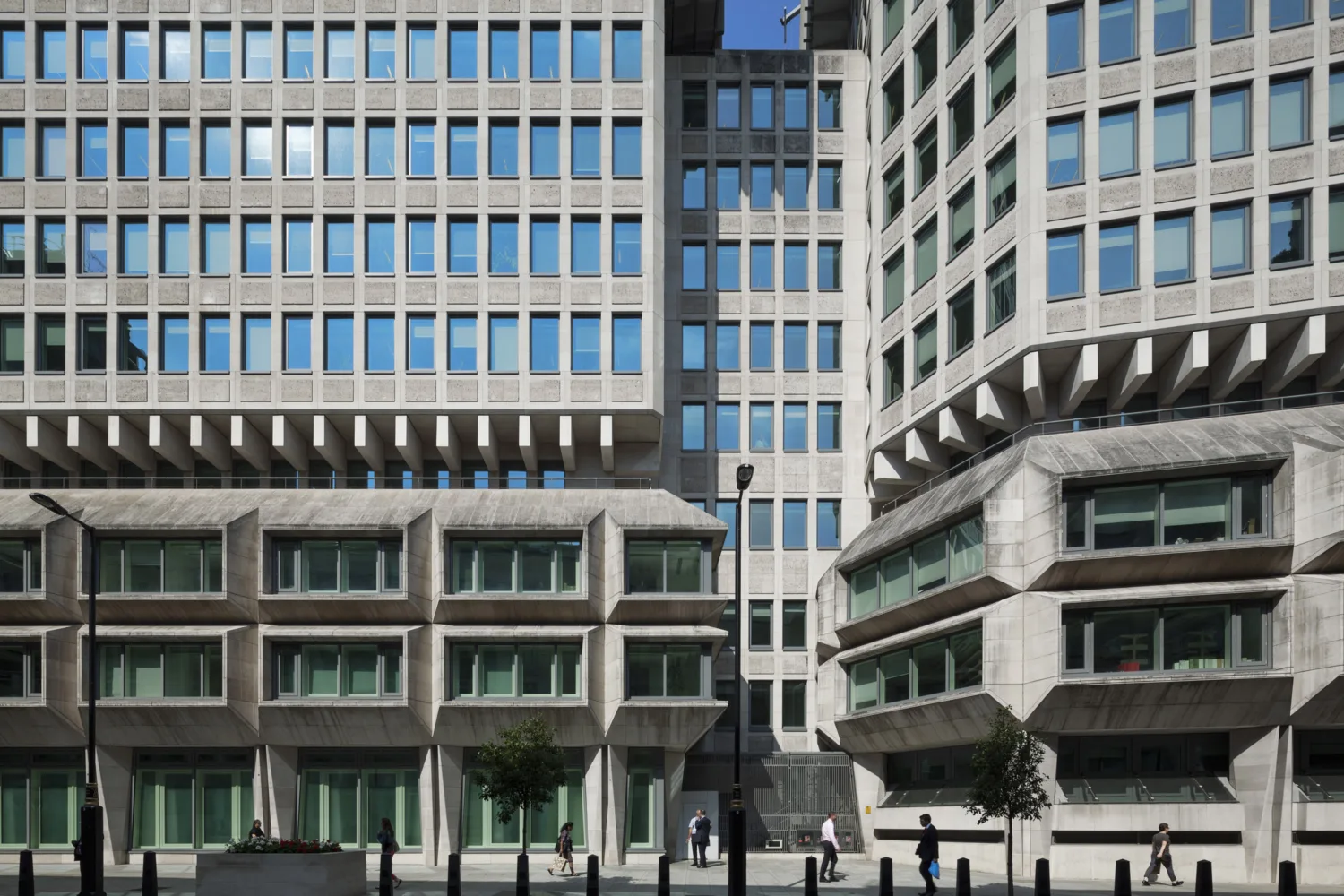 Office interior with a concrete façade and dark glass