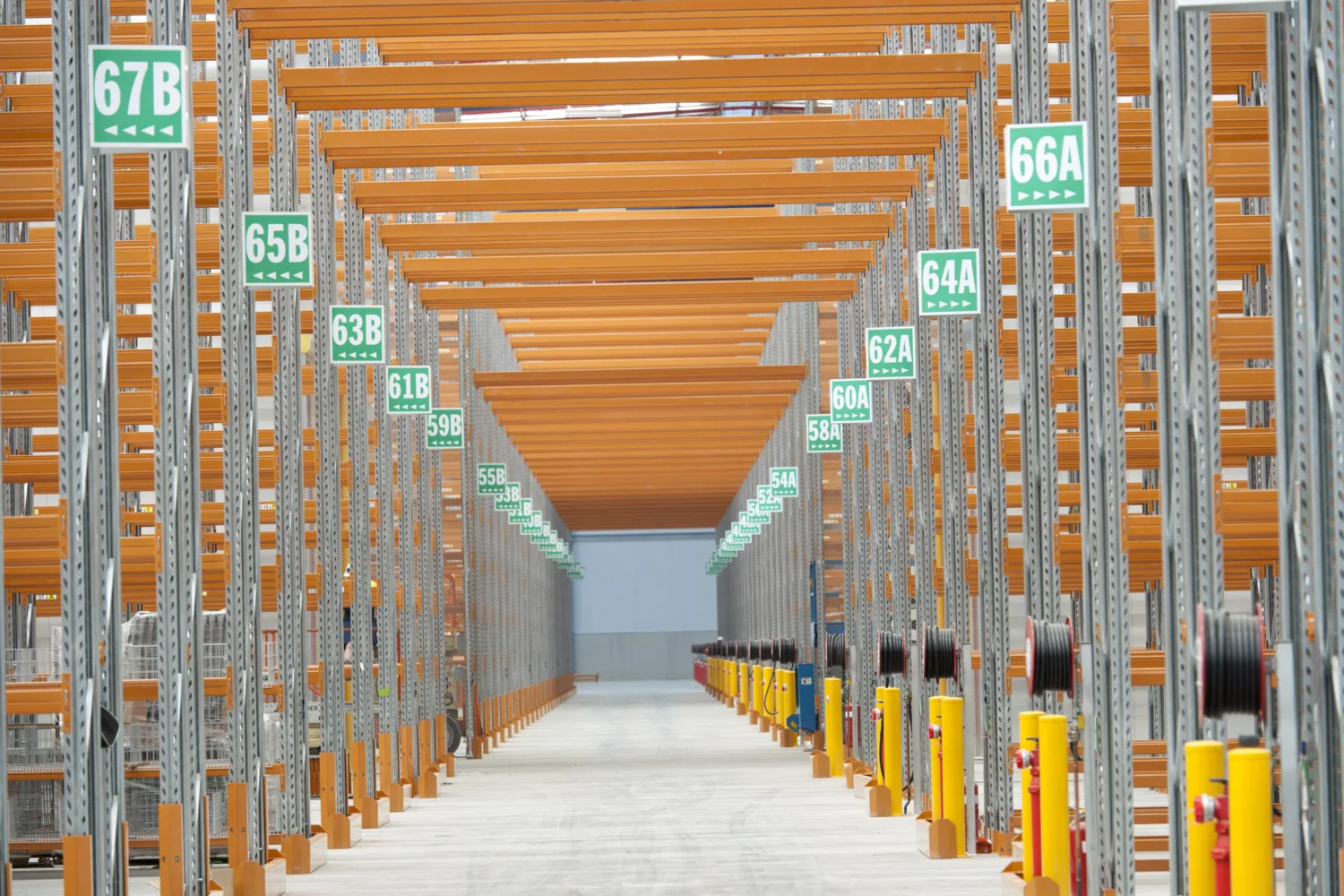 Warehouse interior with shelfing in orange and grey