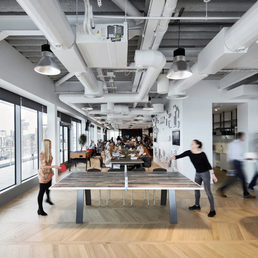 Freshfields Bruckhaus Deringer office interior with ping pong tables and seating for staff