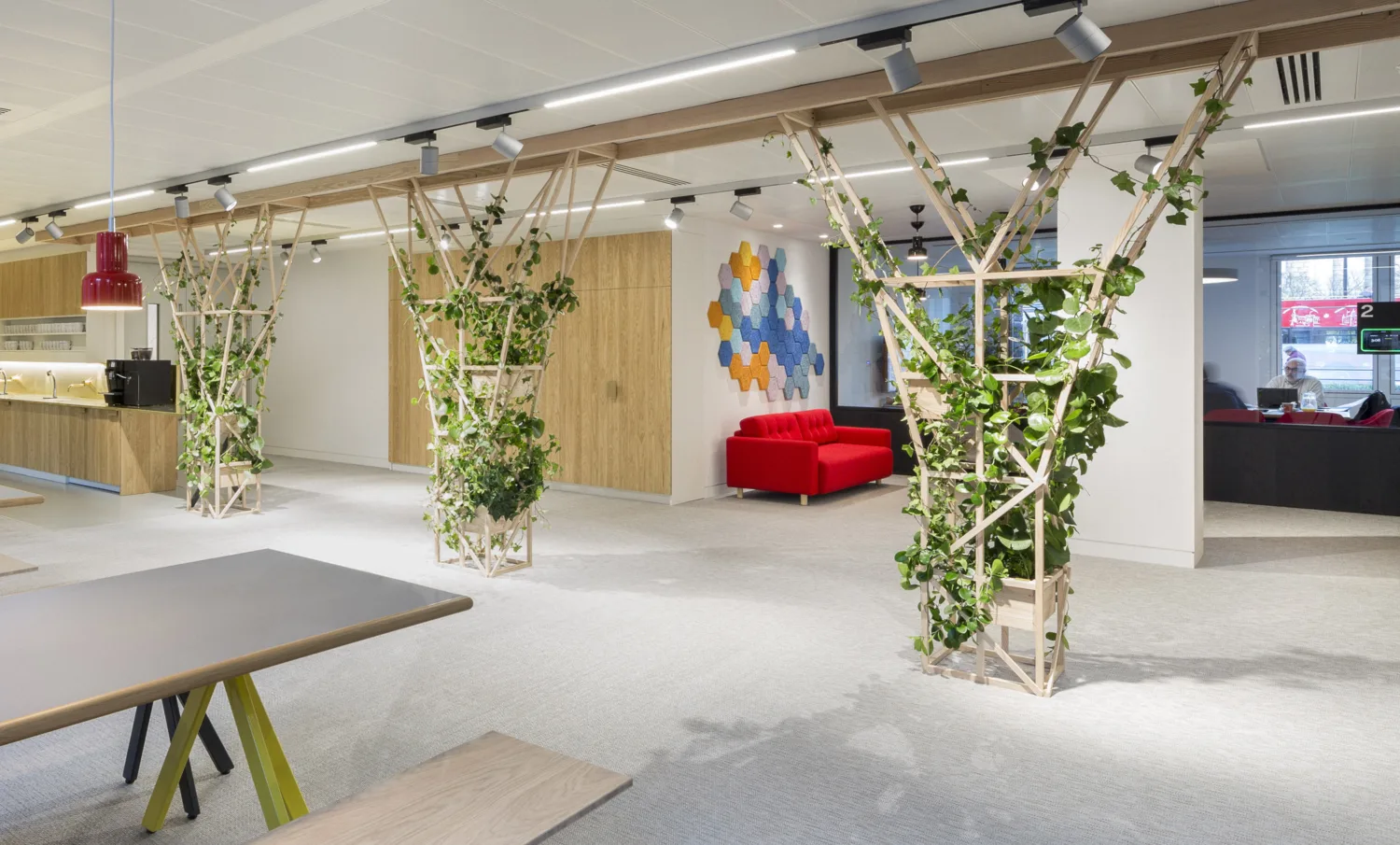 London office reception area with seating and planting
