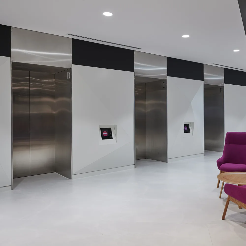 Lift area with touch screens and seating