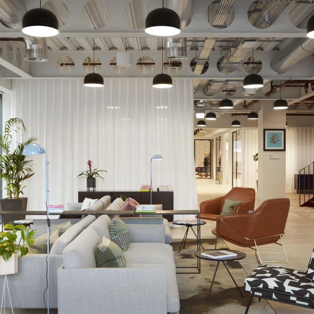 FORA (Reading) office interior with seating and hot desk space with planting