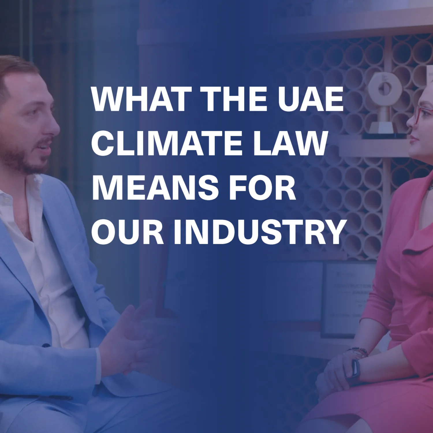 Two people seated across from each other in a professional setting; one in a light blue suit, the other in a red dress. Background shows circular-shelved wall and framed certificates. Text reads: “WHAT THE UAE CLIMATE LAW MEANS FOR OUR INDUSTRY”.