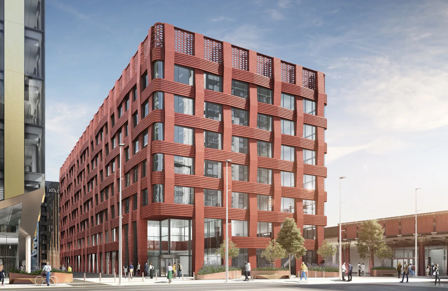 Red weaved facade of a rectangular building against a blue sky