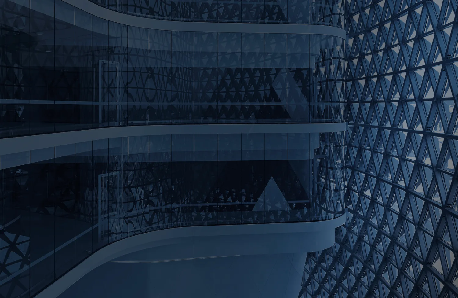 Building interior behind a geometric facade