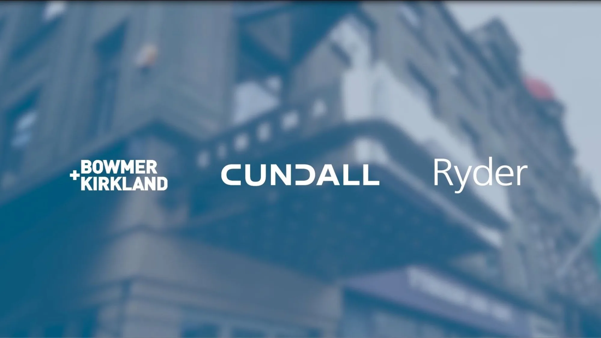 blurred image of a building with a blue tint and Bowmer + Kirkland, Cundall and Ryder logos