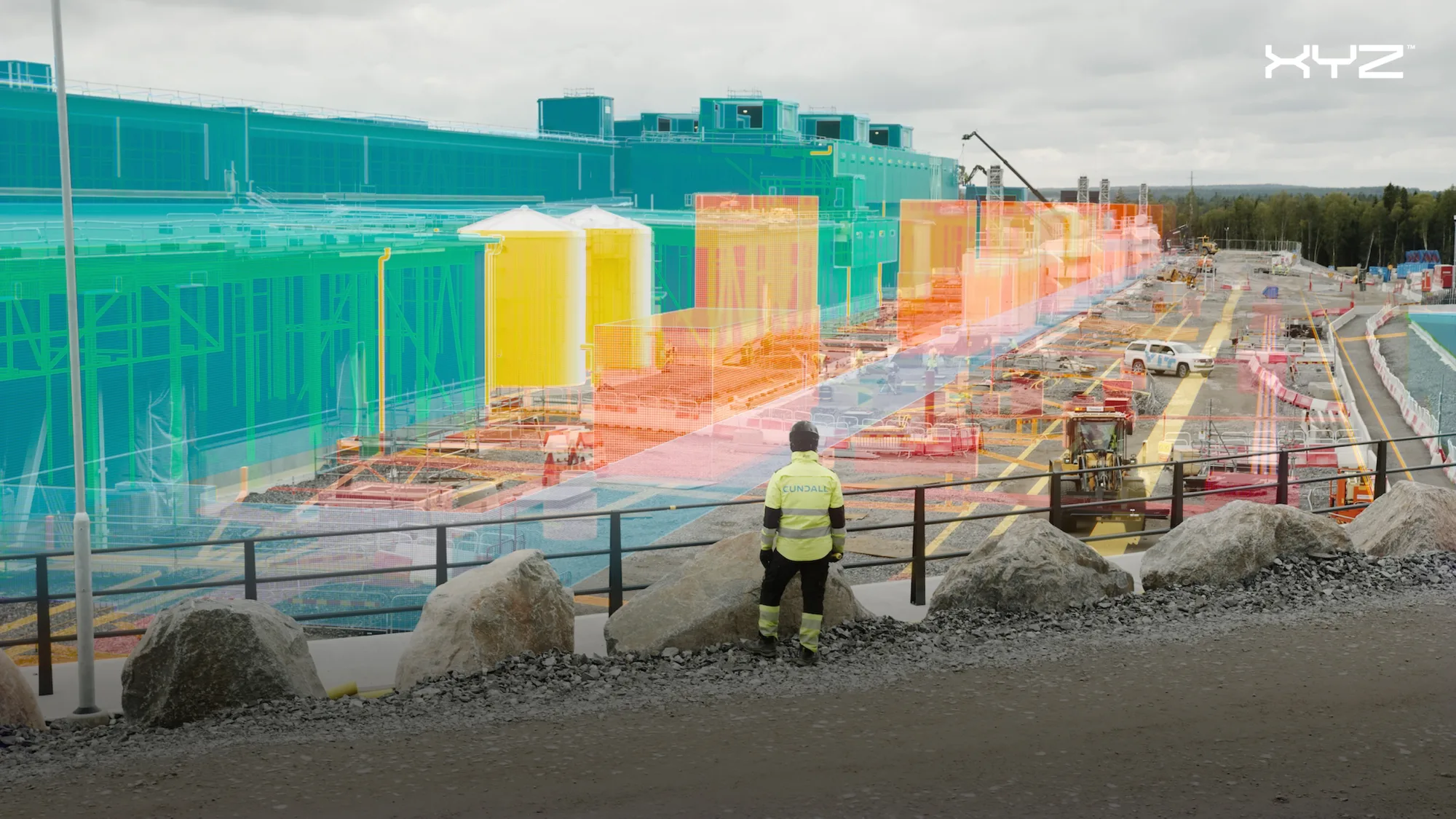 Person in a high visability jacket on a building site with a digital render superimposed