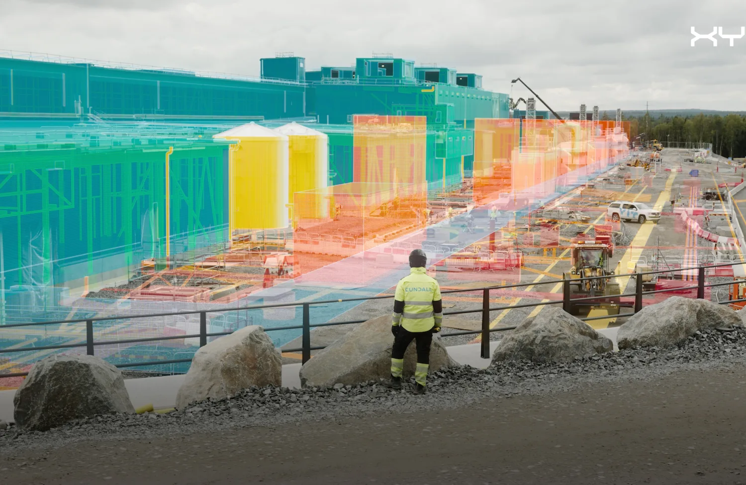 Person in a high visability jacket on a building site with a digital render superimposed