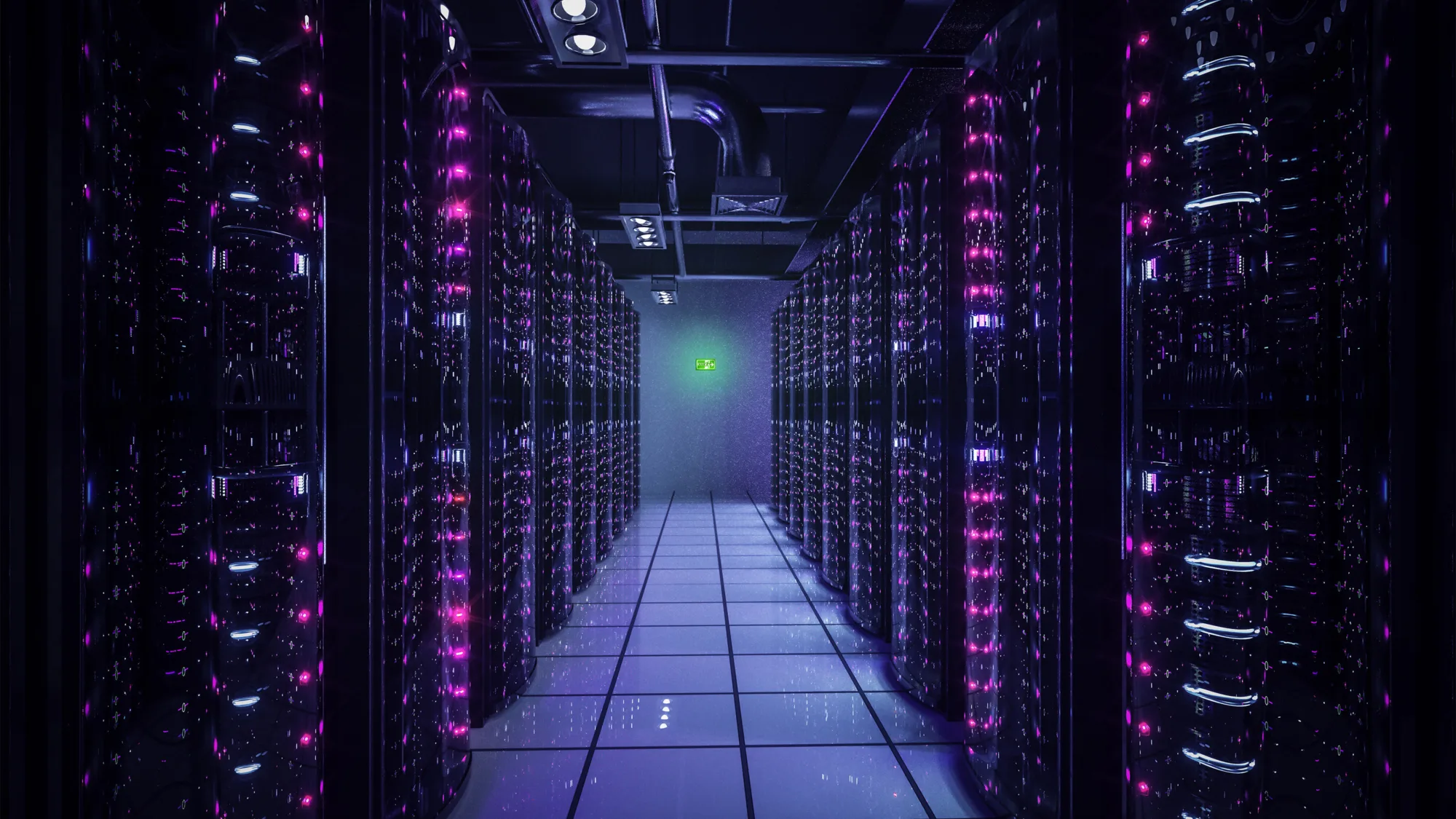 Long corridor of servers lit with pale blue and pink lights with an illuminated exit sign on the back wall