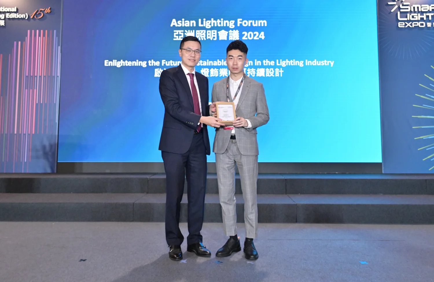 Pete Shing receiving a plaque during the HKTDC Asian Lighting Forum 2024 event