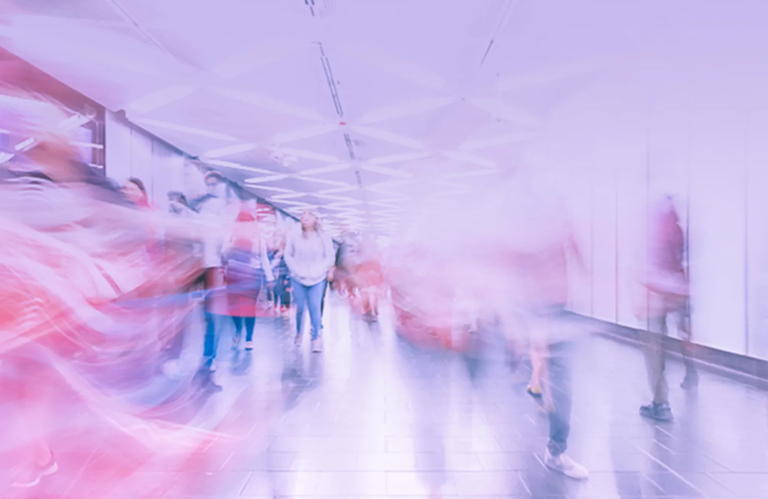 Long exposure image of people walking in a corridor