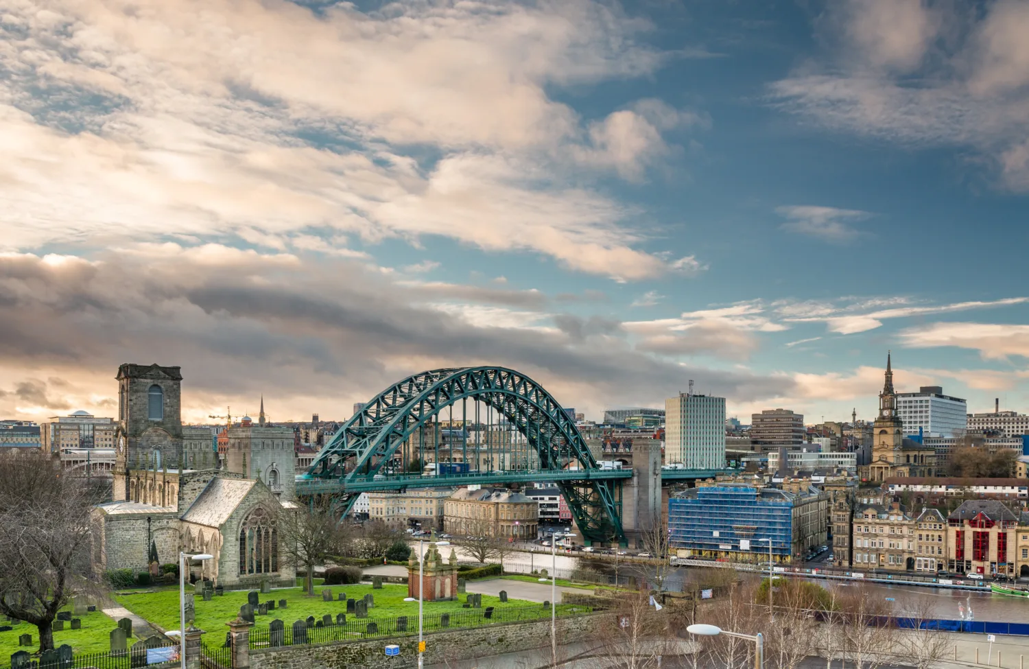 Church and graveyard next to bridge over the river Tyne