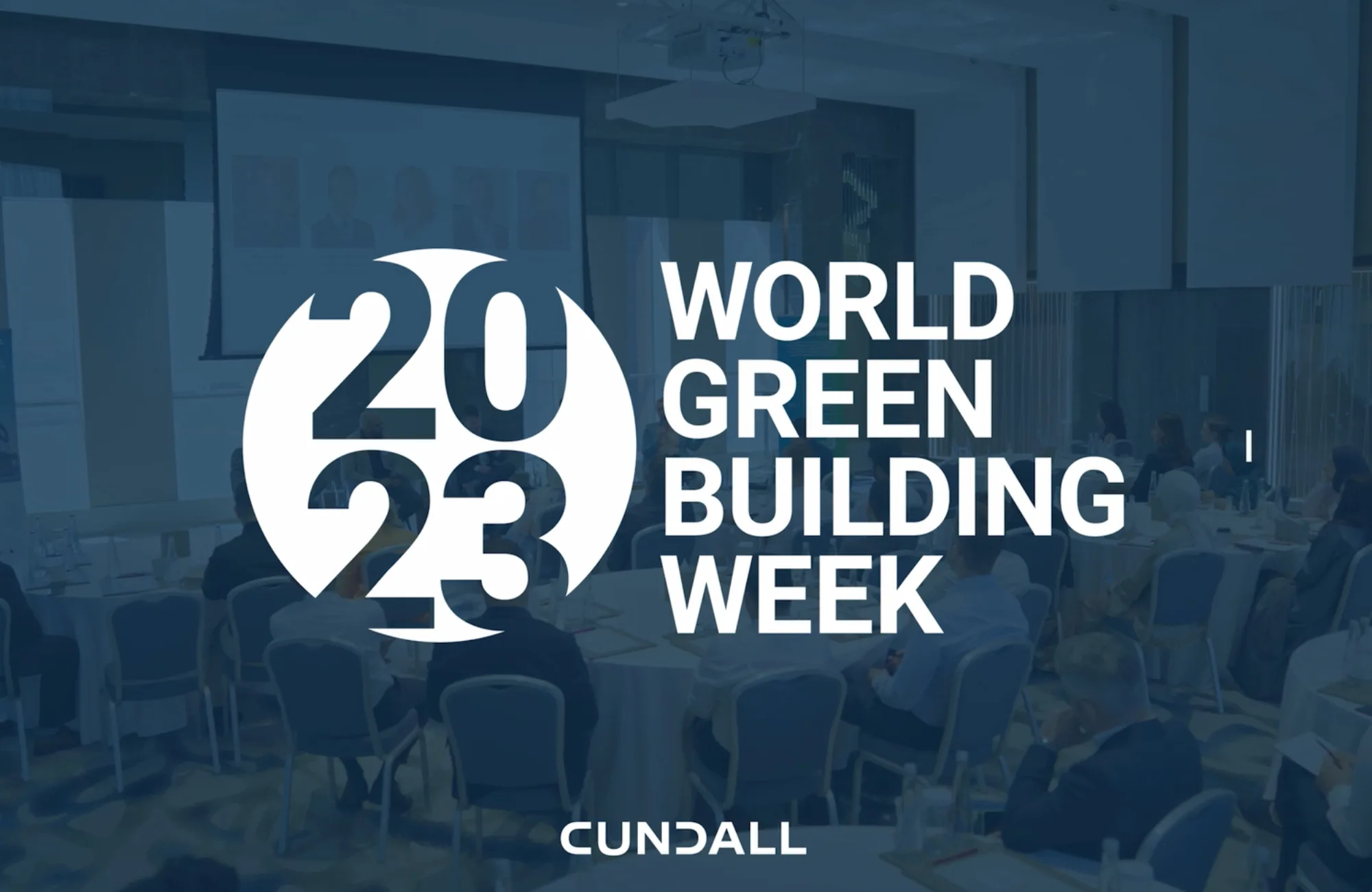 Presentation meeting space with a blue transparency and the World Green Building Week and Cundall logo