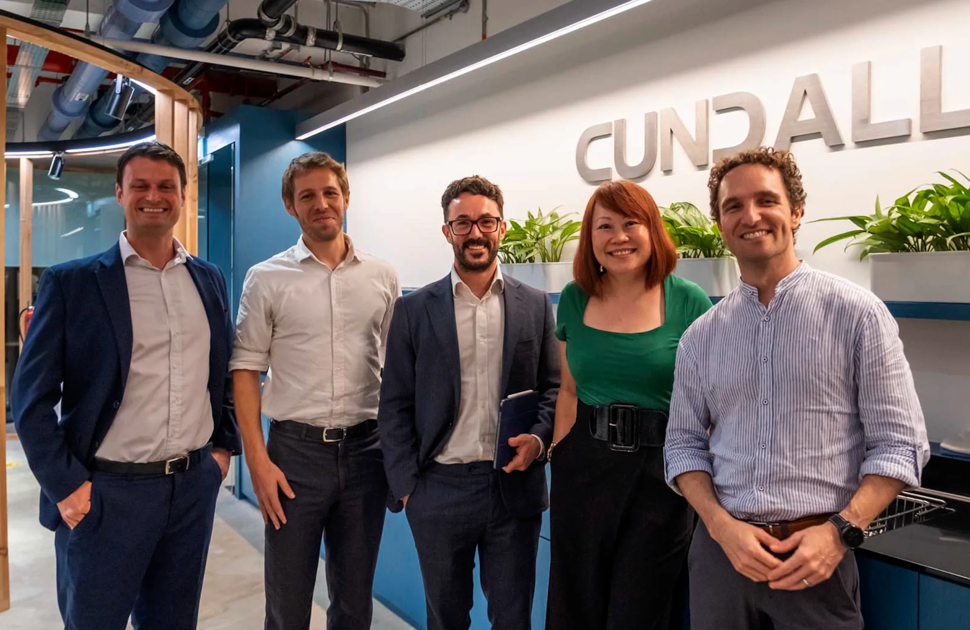 Speakers of the Data, Dollars, and Design (DDD) discussion posing for a group picture in our Cundall Singapore office