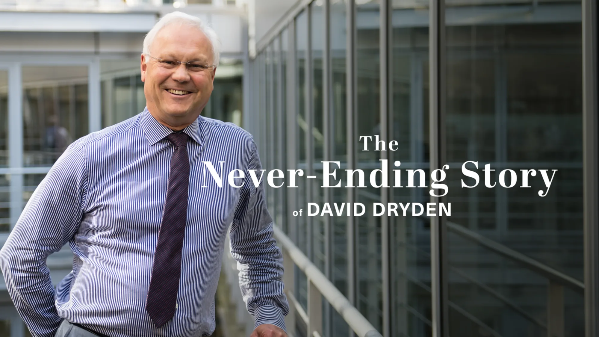 David Dryden posing in front of glazed windows