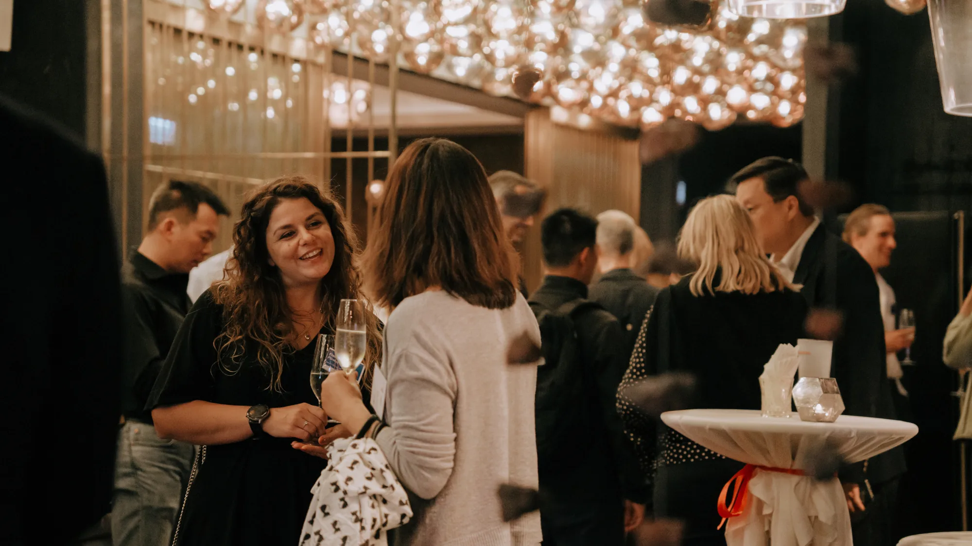 Shot of people drinking and talking at the party