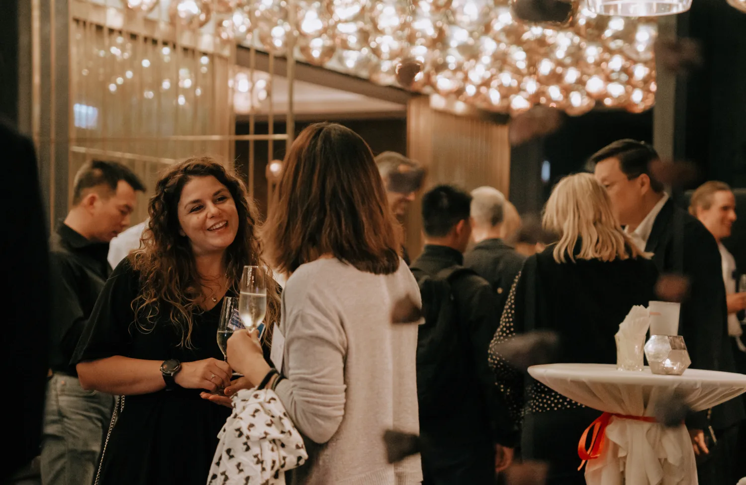 Shot of people drinking and talking at the party