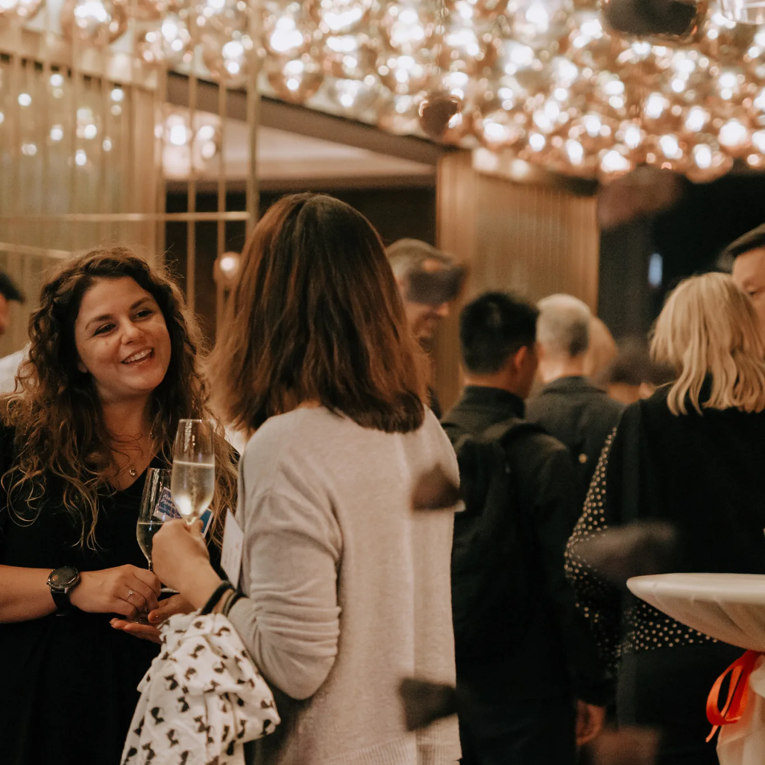 Shot of people drinking and talking at the party